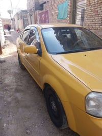 فورنزا موديل ٢٠٠٨ بغداد رقم نكليزي باسمي هيئه وغرامات مصفره سياره جاهز...