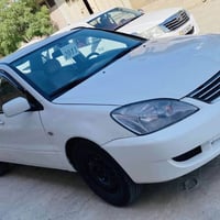 لانسر ٢٠١١ • اوتوماتيك • كالار