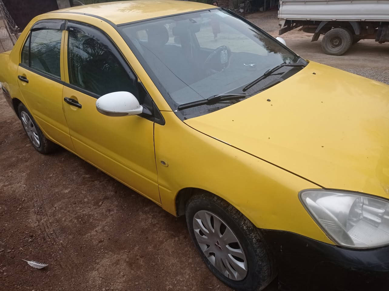 لانسر 2010 بسمي مصفره كامل سنويه 31 رقم بغداد    سعر 64 وبيه مجال حك الجيه ***********
