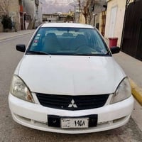لانسر ٢٠٠٧ • اوتوماتيك • أبيض