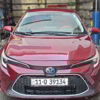 كورولا 2024 هايبرد LE ماشية 40 الف كم وارد امريكي نظام AWD حساس دفع رب...