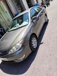 كامري 2003 وارد امريكي رقم بغداد مصبوغه عام  ضرره جاملف الخلفي مكينه 2...