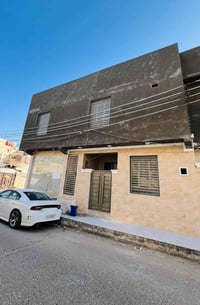 بناية للبيع • الشهداء مقابل جامعة العين • عوائد ٢مليون