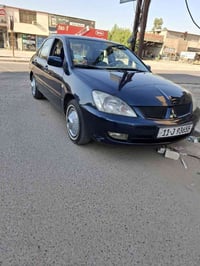 مرخصت الدمن لانسر خليجي ٢٠٠٩ مكينه قبق اسود السياره مصبوغه جماليه جانت...
