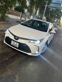 كورلا هايبرد 2025 مرقم بغداد بأسمي  ماشيه 4 الاف  مكفوله من البارد وال...