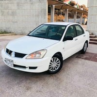 لانسر • ٢٠٠٩ • اوتوماتيك