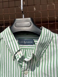 قميص بولو • قياس XL • توصيل متوفر