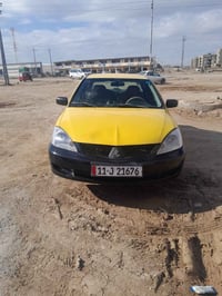 سياره لانسر ٢٠١٠ رقم بغداد بأسمي سنويه لحد ٢٠٣٠ كير محرك خير من الله ت...