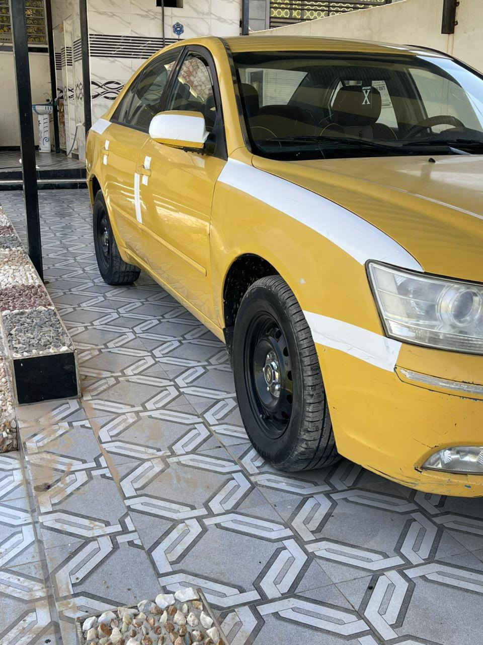السلام عليكم سوناتا تكسي خطها بغداد عزيزيه خليجي مكفولة من الدعمه والتبديل بسمي سعرها ٩٥بيها مجال قليل رقم تلفون ***********

