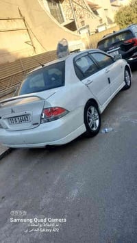 من رخصت الادمن للبيع مستعجل لانسر وارد موديل 2005 رياضي محرك جبير 2000...