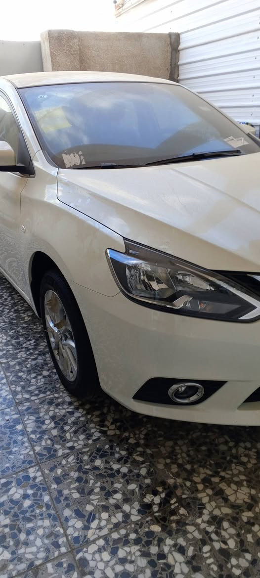 نيسان سنترا موديل 25زيرو رقم أربيل الجديد باسم شركة تحويل وكالة مجانا داخل مشمشي جلد  شاشة جنل للاتصال ***********
