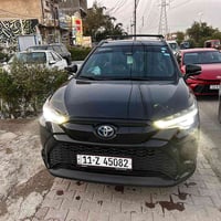 تويوتا كورلا كروس SE  هايبرد  وارد امريكي  تبديل جاملغ فقط وصبغ  الباب...