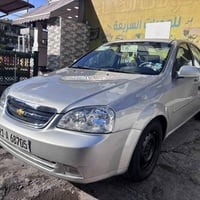 عندي اوبترا 2010 لون رصاصي فضي رقم سليمانية الجديد كير محرك مكفولات صد...