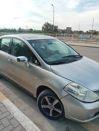 سياره نيسان تيدا خليجي٢٠٠٧ محرك ١٦٠٠ رفم بغداد انكليزى ابيع صبغ حزام م...