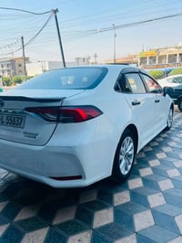 كورلا موديل 2024 هايبرد داخل احمر سياره جديده معنا كلمه ماشيه 30 مكفول...