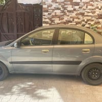 كيا ريو 2006 وارد امريكي رقم بغداد الانكليزي بأسمي ماشيه 106 تبريد شغا...