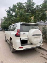 برادو 2021  رقم بغداد بأسمي داخل جلد بيجي فتحه سقف  دبل تانكي  ماشيه 1...