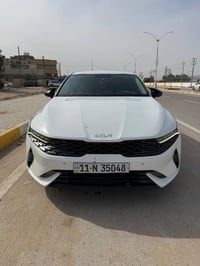 K5 موديل 2023 رقم بغداد  سياره كفاله فقط دحجه بالباب ماشيه ١١٠  1_ بصم...