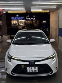 كورلا هايبرد العلامة الزركه الشكل الامريكي   فول مواصفات داخل احمر كشن...