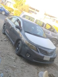 للبيع كورلا ٢٠١٠ كير او محرك مكفولات فتحه بلسقف  مصبوغه حزام اثر جراد ...