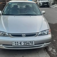 كورلا موديل 2000يسرا بلاد جديده مكينه كير تبريد صدر خلفي امامي تخم تاي...