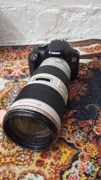 كانون d4000  نضيفه شتر 2k مع عدسه ٧٠.٢٠٠ مفتوحه لغرض التنضيف  شاحنه  و...