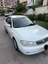 نيسان سني موديل 2009 ابيض اللون رقم بغداد باسمي حادثها جاملغ تبديل قطع...