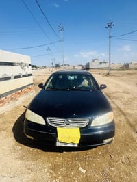 سياره نيسان مكسما موديل 2000لايت زنون عالي ناصي  رقم بغداد بأسمنه مصبو...