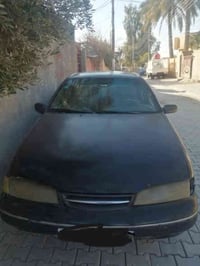 برنس رقم بغداد موديل 95 باسمي السياره كير ومحرك مكفوله من الصبغ والضرب...