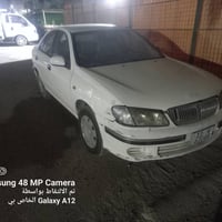 للبيع فقط نيسان سني 2001 سيارة مصبوغه عام تخم تاير بطاريه جديد كهربائي...