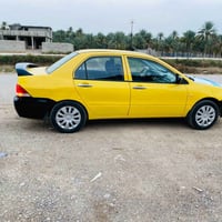 لانسر ٢٠١٠ • مكينه وكير مكفولة • رقم بغداد