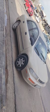 مازدا 323 • ١٩٩٧ • رقم دولي