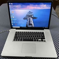 ماك بوك برو حجم ١٥ انج   ويا شاحنه الاصليه الجهاز محول ويندوز و صار بط...