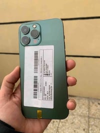 جهاز أيفون 📱 13 pro max زيتوني مبدل بطارية 🔋 بالخانه قطع الغيار غير مع...