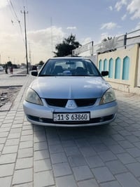 لانسر موديل 2007مصبوغة للجمالية سونرها موجود تبريد شغال صدر امامي 50‎%...