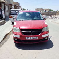 سيارة دوج كرفان للبيع موديل 2012جاهزة من كلشي السيارة بيها صبغ بدون حا...