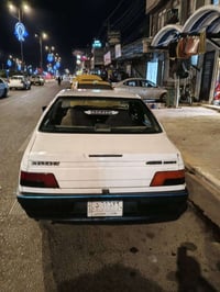 بيجو 405موديل 11رقم بغداد شرط التحويل مكينه فرنسي توني شاده  كير مكفول...