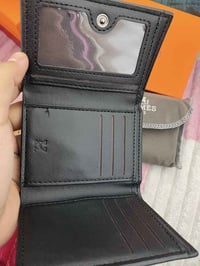 محفظة رجالي • ماركة