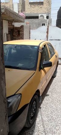 عندي سياره لانسر 2010  بغداد مدينه الصدر رقم الهاتف 07714280493