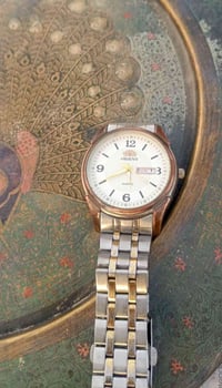 اورينت تريستار • ساعة يد • مؤشر التاريخ واليوم