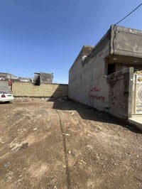 قطعة للبيع 100 م - بوب الشام.زراعي منطقة اسوار بغداد السعر 18 وبيها مج...