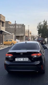 كورلا وارد أمريكي موديل 2024 رقم (بغداد) بأسمي  بيها قطعتين صبغ الباقي...