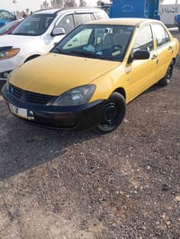 لانسر موديل 9 مصفرة هيئة وغرامات الي يريد يتصل ما متواجد على الفيس 077...