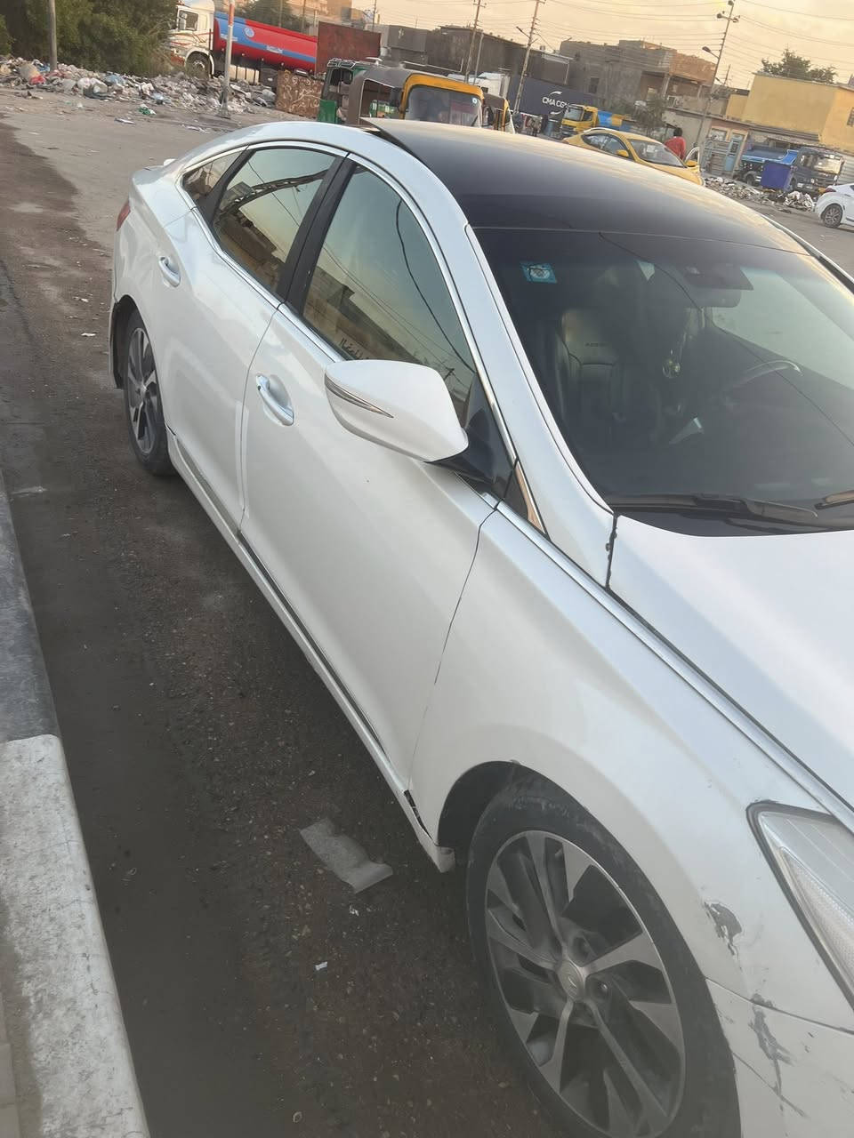 ازيرا 2012 رقم بغداد ابيض صدفي بيها ربع  خلفي موضح بالصور بيها ملاحظات مكان السيارة بصرة الفيحاء خلف المحافظة *********** السعر 100
