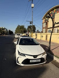 كورلا هايبرد للبيع موديل 2024 ماشيه 18 الف فتحة سقف كشنات جلد رادار تح...