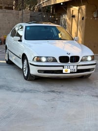 للبيع BMW  موديل 1998 لون ابيض  رقم بغداد جديد هزه جديده  فتحه سقف طكت...