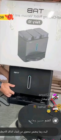 في الصورة جهاز هو عبارة عن مكنسة روبوت ذكية مع محطة إرساء (Docking Sta...