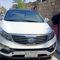 سيارة سبورتج موديل 2011 خليجي لون ابيض رقم بغداد باسمي بنوراما السعر 1...