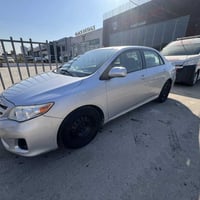 كورلا 2011 للبيع فقط وارد امريكي بيها صبغ باب عكس سايق خلفي  محرك 1800...