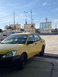 لانسەر ٢٠١٠  مەکینە گەورە سەنەوی پلاستیک سەیارەکە زۆر پاکە لێدران و بۆ...